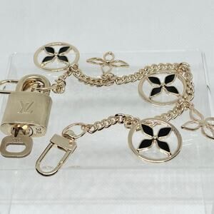 Louis Vuitton Gold Lock & Key Set #313 with a Monogram Flower Bag Chain|Charm